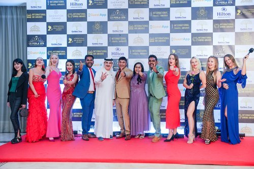 Winners celebrating together on the red carpet