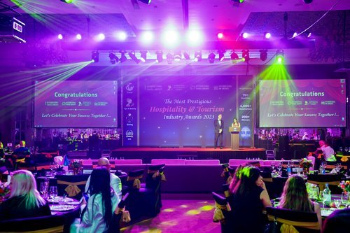 Host addressing guests at the gala ceremony